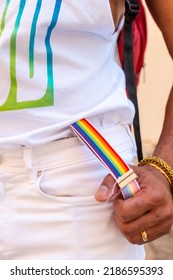 Rainbow Suspenders With The Hand Of A Gay Black Ethnicity Man At The Pride Party, LGBT Flag