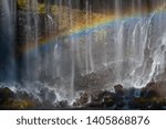 Rainbow that appeared in a waterfall with a stream of water