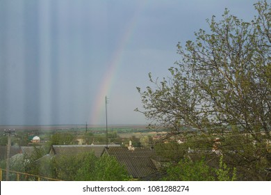 rainbow window reflection on bright blue sky after the rain/ rainbow cityscape view