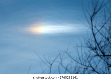 Raindbow orb in the sky seen from the Bear River in Northern Uta