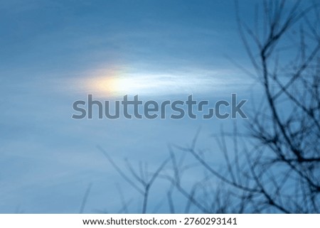Raindbow orb in the sky seen from the Bear River in Northern Uta