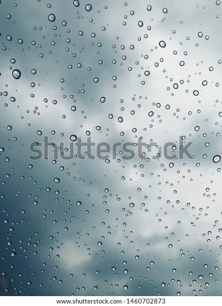 Raindrop on car window\
background