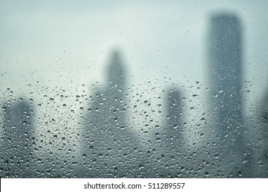 raindrop on window with city view blur background, depress emotion feeling of metropolis - Powered by Shutterstock