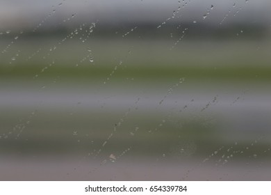 raindrop on window in a cloudy day