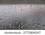 Raindrop, raindrops running down the window
