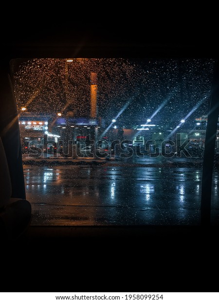 Raindrops at the car window at\
night