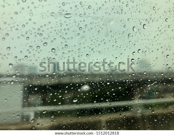 Raindrops from cars window\
on the road