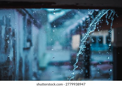 Raindrops cascade down a window, creating a tranquil, moody scene.