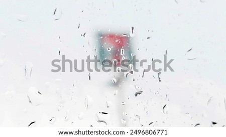 Raindrops fall down against the window with 7-Eleven sign blur. Raindrops window rain. 7-Eleven is your go-to convenience store, Generally open 24 hours a day, Thailand, August 1, 2024