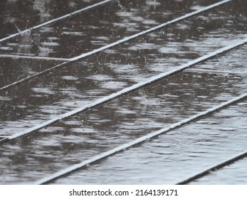 Raindrops Falling On Wet Wood Plastic Composite Floor Of Walkway Texture