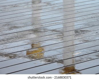 Raindrops Falling On Wet Wood Plastic Composite Floor Of Walkway Texture