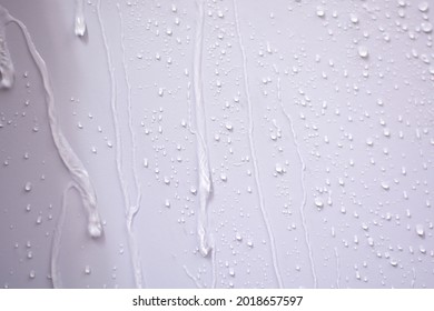 Raindrops fell on the wall and saw the raindrops flowing in a long way.The water flowed through the walls as a stream of water splashed and saw beautiful patterns. - Powered by Shutterstock