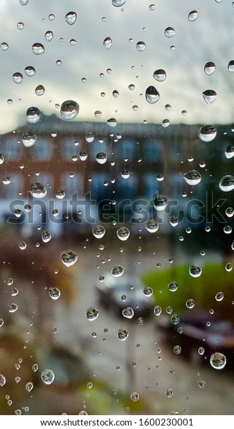 raindrops flow down my
window
