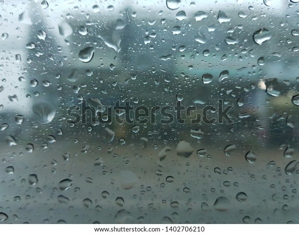 raindrops on car glass in the\
raining