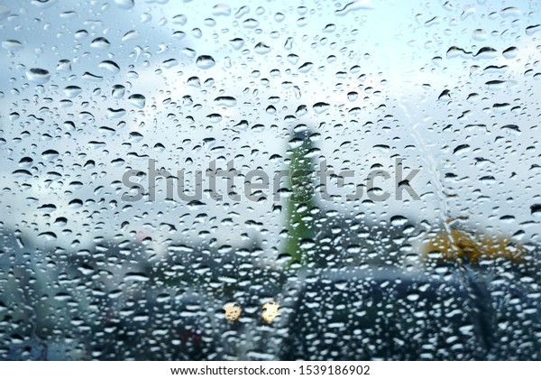 Raindrops on a car glass. Rainy autumn day,\
foggy windows and wet\
windows.