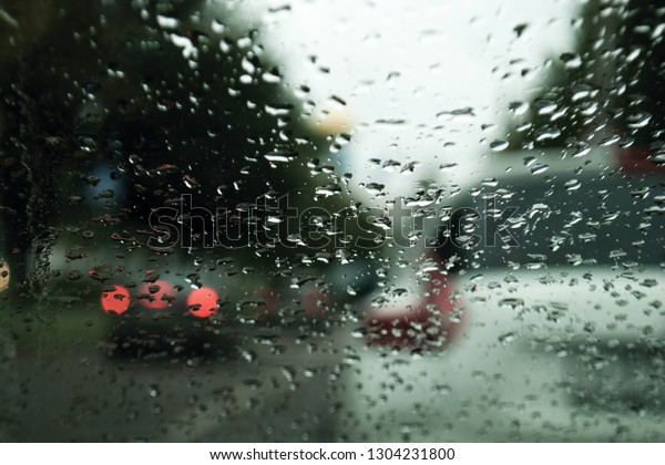 
Raindrops on the car window. City background
from car window.