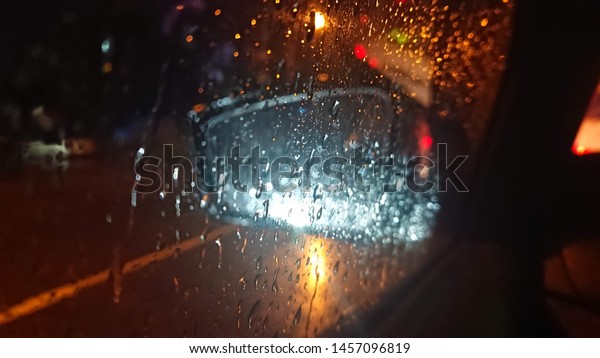 raindrops on car window at
night