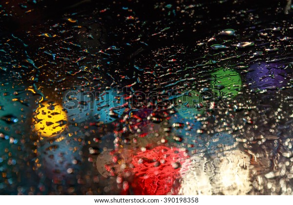 raindrops on a car window at night in the city,\
Street Bokeh Lights\
defocused