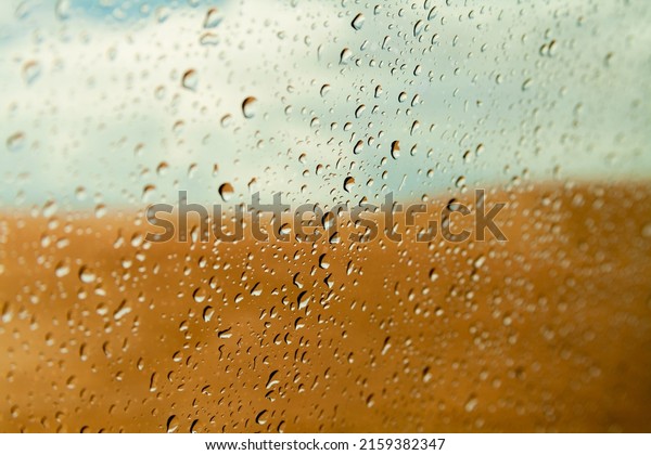 raindrops on the car window. Rainy\
day inside the car. bad weather concept. low spirits\
concept.