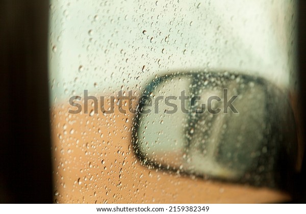 raindrops on the car window. Rainy
day inside the car. bad weather concept. low spirits
concept.