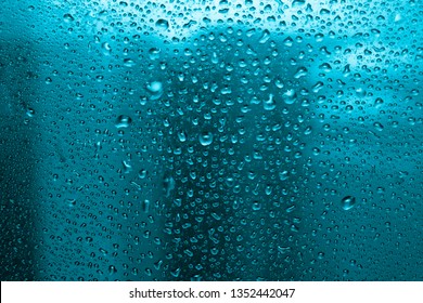  raindrops on glass, condensate - Shutterstock ID 1352442047