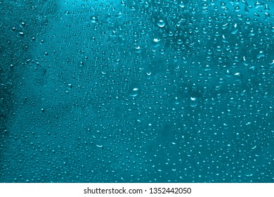  raindrops on glass, condensate - Shutterstock ID 1352442050