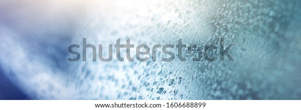 Raindrops on gray-black walls, glass on\
cars, rain drops on clear windows or raindrops on glass of\
raindrops or window vapors, clear blue-white water\
droplets