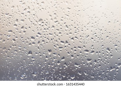 Raindrops On Muddy Window Pane