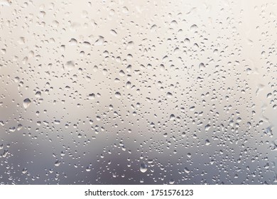 Raindrops On Muddy Window Pane