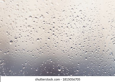 Raindrops On Muddy Window Pane