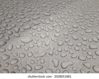 Raindrops On A Silver Car Bonnet