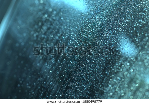 Raindrops on walls, glass on cars, rain drops on\
clear windows or raindrops on glass of raindrops or window vapors,\
clear blue-white water\
droplets