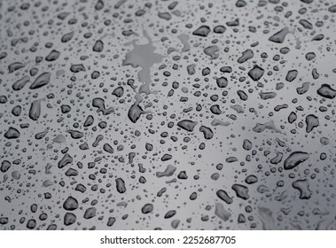 Raindrops on a wet surface. Morning dew. Spilled water. - Powered by Shutterstock