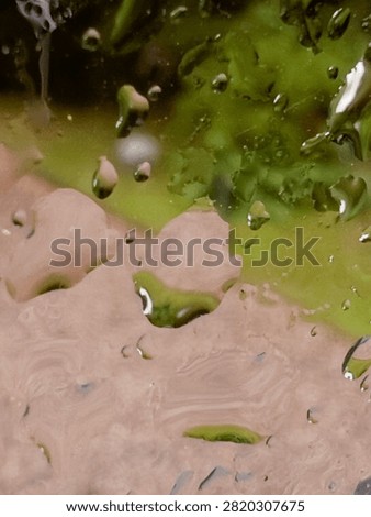 Raindrops on the wet windowpane