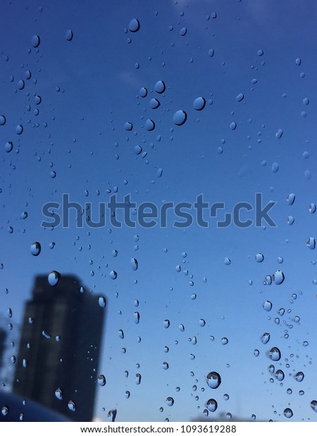 raindrops on window of\
Bangkok , Thailand