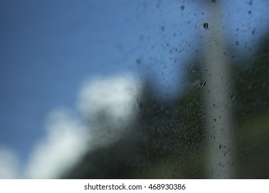 Raindrops on the window with a blury background