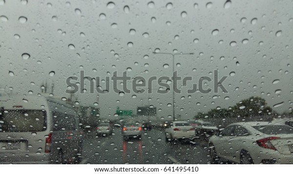 raindrops on\
window from car and makes traffic\
jam