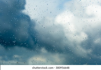 Raindrops on a window during bad, rainy weather.