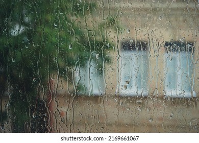 Raindrops On Window Glass Close Up Background.