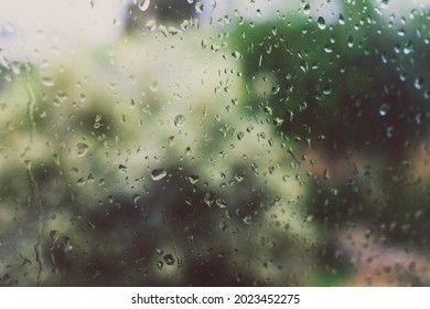 Raindrops On The Window With Out Of Focus Backyard Bokeh During A Cold Winter Storm Shot In Australia