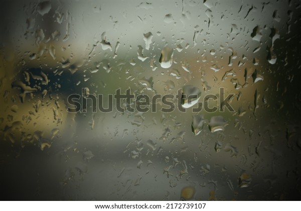 Raindrops on the window, rainy autumn,\
background of drops on the glass.\
Close-up.