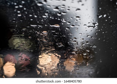 Raindrops On A Windshield On A Rainy Night