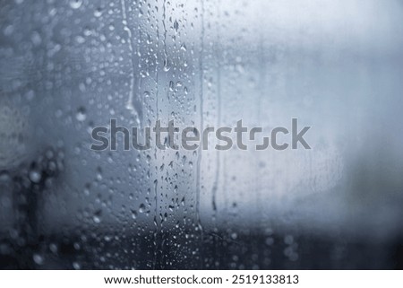 raindrops passing through a window