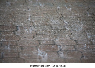 Raindrops Splattering On Cobblestone Tiled Driveway At Security Guard Gatehouse To Gated Community During A Torrential Downpour