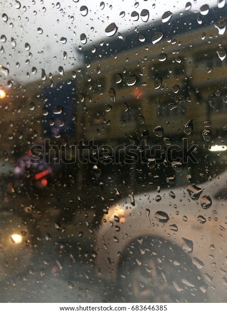 Raindrops, windshield, car\
stick glass