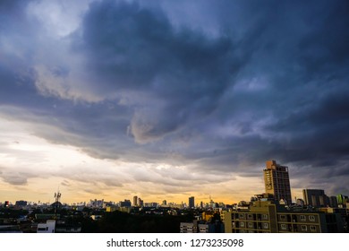 Raining cloud over skyscraper of modern city building, Storm into city - Powered by Shutterstock