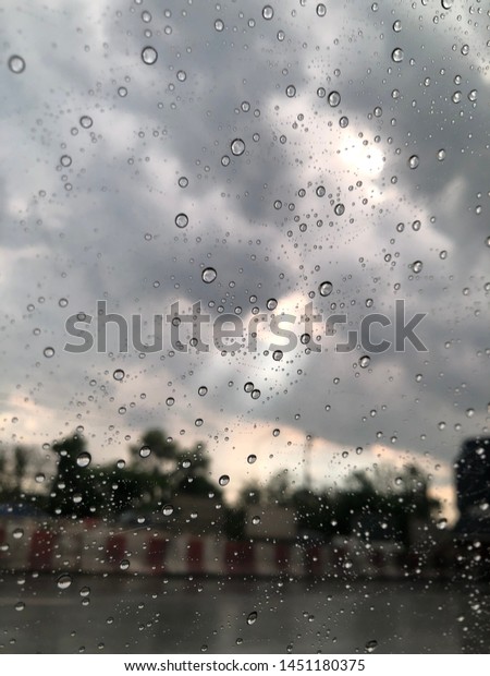 Raining\
day in Bangkok Thailand, rain drop from the\
car