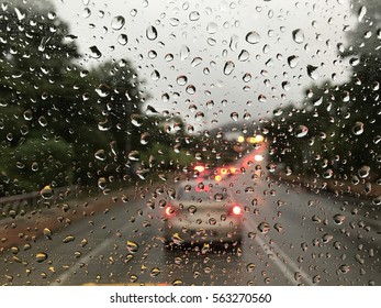 Raining Day Trough The Car Windows In Malaysia Road During Monsoon