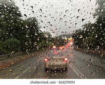 Raining Day Trough The Car Windows In Malaysia Road During Monsoon