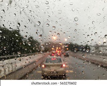 Raining Day Trough The Car Windows In Malaysia Road During Monsoon